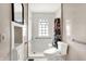 Bathroom featuring a shower-tub combo, a sink, a mirror, and a toilet at 1523 E Mills Ave, Indianapolis, IN 46227