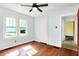 Corner bedroom featuring hardwood floors and natural lighting at 1523 E Mills Ave, Indianapolis, IN 46227