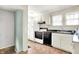 Functional kitchen featuring a white refrigerator and matching cabinets at 1523 E Mills Ave, Indianapolis, IN 46227