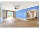 Spacious living room with a sliding glass door, bright windows, and an open layout, creating a comfortable living space at 1523 E Mills Ave, Indianapolis, IN 46227