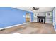 Spacious living room featuring a decorative fireplace, built-in shelving, and an open layout perfect for entertaining at 1523 E Mills Ave, Indianapolis, IN 46227
