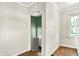 Room features paneled walls, tile floors and neutral colors at 1523 E Mills Ave, Indianapolis, IN 46227
