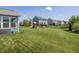 Expansive backyard featuring a playground, lush green lawn, and residential fencing at 16419 Connolly Dr, Westfield, IN 46074