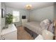 Calm bedroom features a large window, neutral tones, and a comfortable bed at 16419 Connolly Dr, Westfield, IN 46074
