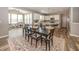 Open concept dining area with a spacious table, adjacent to the kitchen and playroom at 16419 Connolly Dr, Westfield, IN 46074