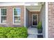 Inviting front entrance with a decorative wreath, brick facade, and green landscaping at 16419 Connolly Dr, Westfield, IN 46074