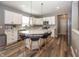 Modern kitchen with white cabinets, stainless steel appliances, and a large center island with barstool seating at 16419 Connolly Dr, Westfield, IN 46074