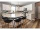 A spacious kitchen with white cabinets, stainless steel appliances, and a large center island at 16419 Connolly Dr, Westfield, IN 46074