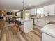 Bright, open-concept kitchen with island seating flows into the living and dining areas at 16419 Connolly Dr, Westfield, IN 46074
