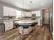 Modern kitchen boasts a large island with seating and pendant lighting at 16419 Connolly Dr, Westfield, IN 46074