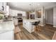 A full view of a modern kitchen with stainless steel appliances and a large island with barstool seating at 16419 Connolly Dr, Westfield, IN 46074