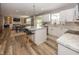 Modern kitchen with white cabinets, granite countertops, and a large center island with barstool seating at 16419 Connolly Dr, Westfield, IN 46074
