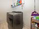 Efficient laundry room featuring modern washer and dryer units with built in shelving at 16419 Connolly Dr, Westfield, IN 46074