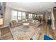 Bright living room with a fireplace, sectional couch, and open layout to the kitchen at 16419 Connolly Dr, Westfield, IN 46074