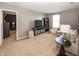 Inviting living room with plush carpeting, neutral tones, and cozy seating arrangement, great for relaxation at 16419 Connolly Dr, Westfield, IN 46074