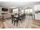 Open-concept living area with dining table, fireplace, and connecting spaces for Gathering enjoyment at 16419 Connolly Dr, Westfield, IN 46074