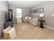 Comfortable living room features neutral decor, soft carpeting and provides a cozy space for Gathering gatherings at 16419 Connolly Dr, Westfield, IN 46074