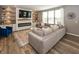 Spacious living room with a large sectional sofa, electric fireplace, and built-in shelving at 16419 Connolly Dr, Westfield, IN 46074