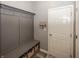 Well-organized mudroom with bench seating, storage baskets, and coat hooks, perfect for entryway at 16419 Connolly Dr, Westfield, IN 46074