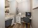 Dedicated office nook with built-in desk and storage, adjacent to the kitchen at 16419 Connolly Dr, Westfield, IN 46074