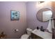Charming powder room boasts modern fixtures, stylish decor, and a soothing color palette at 16419 Connolly Dr, Westfield, IN 46074