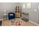 Cozy sitting area features a stylish bar cabinet, comfortable chair, and unique decor at 16419 Connolly Dr, Westfield, IN 46074