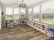 Spacious sunroom featuring hardwood floors, and lots of bright natural light from multiple windows at 16419 Connolly Dr, Westfield, IN 46074