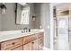 Stylish bathroom features wood vanity, modern fixtures, and plenty of space for a functional and elegant design at 1799 Hourglass Dr, Carmel, IN 46032