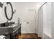 Neat bathroom featuring a sleek vanity with a modern sink and shower/tub combo at 1799 Hourglass Dr, Carmel, IN 46032