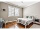 Serene bedroom with a minimalist design, featuring soft colors and a comfortable bed at 1799 Hourglass Dr, Carmel, IN 46032