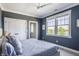 Comfortable bedroom with natural light, a cozy bed, and ample closet space for organized living at 1799 Hourglass Dr, Carmel, IN 46032