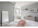 Bright bedroom features white trim, plush bed, and stylish decor creating a cozy and inviting space at 1799 Hourglass Dr, Carmel, IN 46032