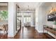 Spacious foyer featuring hardwood floors, white trim, and staircase access at 1799 Hourglass Dr, Carmel, IN 46032