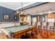 Recreation room features a pool table, wet bar with seating, and easy access to other areas at 1799 Hourglass Dr, Carmel, IN 46032
