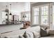 Open-concept view from the living room into the kitchen and dining areas, showcasing natural light at 1799 Hourglass Dr, Carmel, IN 46032
