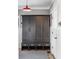 Mudroom features a large storage locker with seating, drawers, and coat hooks for seamless organization and entryway appeal at 1799 Hourglass Dr, Carmel, IN 46032