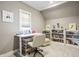 Bright office featuring a standing desk, organized shelves, and a comfortable chair for productivity at 1799 Hourglass Dr, Carmel, IN 46032