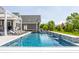 Inviting swimming pool with waterfall features and ample poolside lounging space at 1799 Hourglass Dr, Carmel, IN 46032