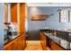 Close-up of the wet bar showcasing rich cabinetry, a sleek countertop, and modern fixtures at 1799 Hourglass Dr, Carmel, IN 46032