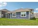 Enjoy backyard views from this home's spacious, screened-in porch at 1807 Orchard Dr, Fortville, IN 46040
