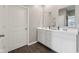Bathroom featuring double sinks, quartz countertops, and sleek fixtures at 1807 Orchard Dr, Fortville, IN 46040