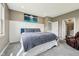 Tranquil bedroom with a plush queen bed and private ensuite bath at 1807 Orchard Dr, Fortville, IN 46040