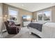 Serene bedroom featuring comfortable furnishings, a large window with neighborhood views, and soft lighting at 1807 Orchard Dr, Fortville, IN 46040