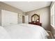 Comfortable bedroom with a plush bed, a dark wood dresser, and ample closet space for storage and style at 1807 Orchard Dr, Fortville, IN 46040