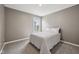 Inviting bedroom with neutral walls and decor, featuring a comfortable bed and ample natural light at 1807 Orchard Dr, Fortville, IN 46040