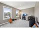 Bright bedroom with natural light, featuring a dedicated workspace and serene views of the outdoors at 1807 Orchard Dr, Fortville, IN 46040