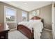 Cozy bedroom featuring a classic wooden bed frame, soft carpeting, and lots of natural light at 1807 Orchard Dr, Fortville, IN 46040