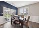 Elegant dining room featuring a modern table with seating for six and sliding glass door access at 1807 Orchard Dr, Fortville, IN 46040