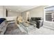 Spacious living room with plush sofas, a modern coffee table, neutral walls and a staircase view at 1807 Orchard Dr, Fortville, IN 46040