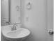 Modern bathroom with a pedestal sink and a framed mirror at 1943 Black Oak Dr, Shelbyville, IN 46176